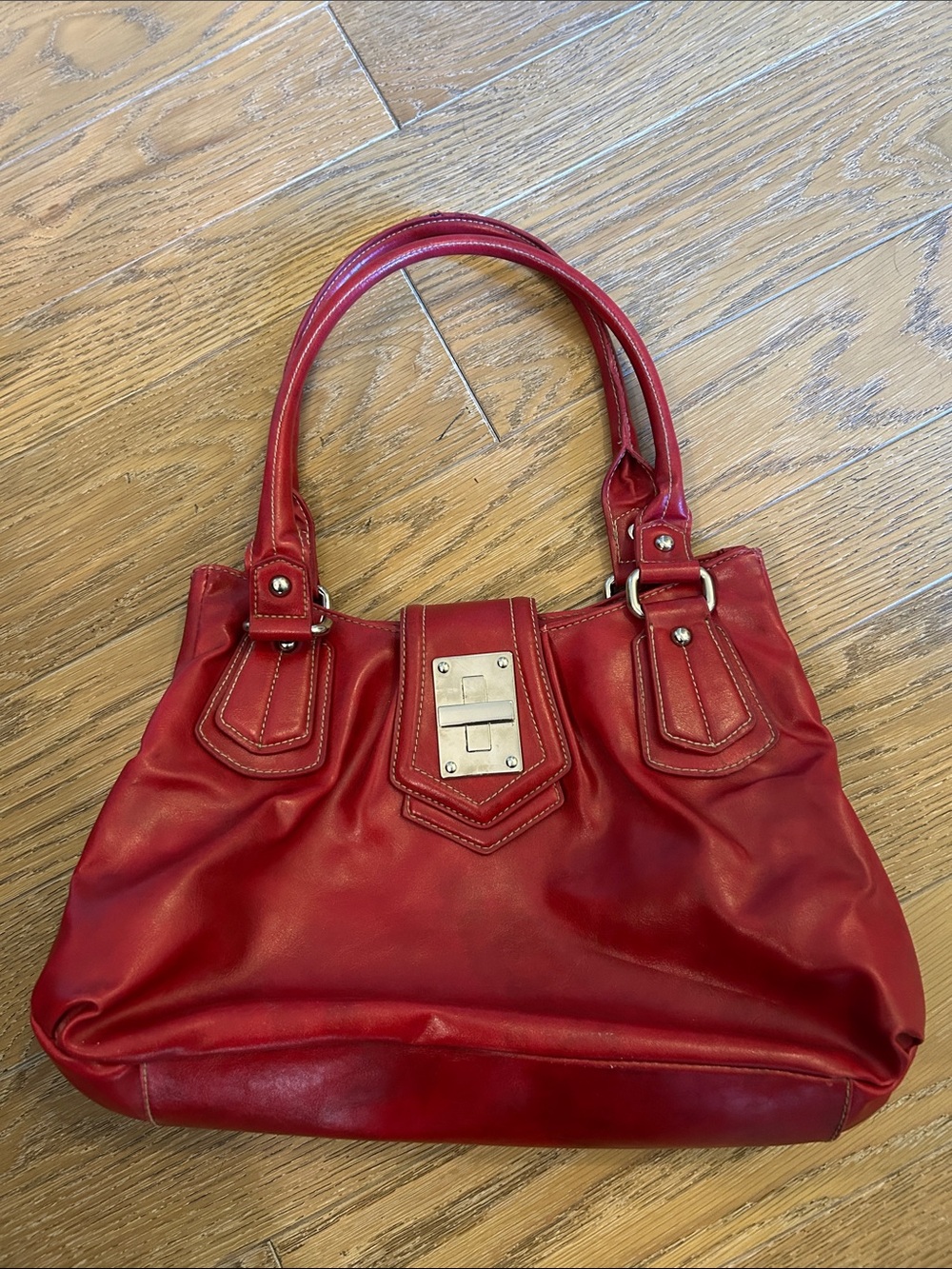 Red purse with straps and 3 large compartments